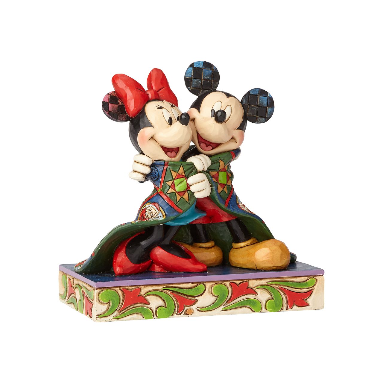 Jim Shore Warm Wishes Mickey and Minnie Mouse Figurine  Remember those cosy winter nights and lazy mornings, lounging in your new Christmas PJ's sipping hot chocolate and watching your favourite Disney film? This was the inspiration for this Mickey Mouse personality pose by Jim Shore. 