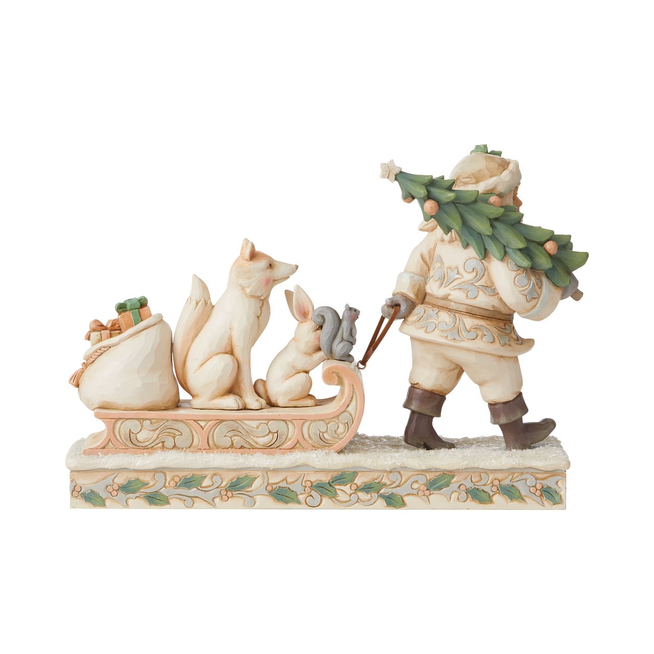 Jim Shore White Woodland Santa Pulling Sled Figurine  "A Wandering We Go" Santa is getting ready for Christmas with his furry friends. This piece features Santa dressed in the iconic, muted colours of White Woodland, whilst pulling a sled of forest animals and gifts.