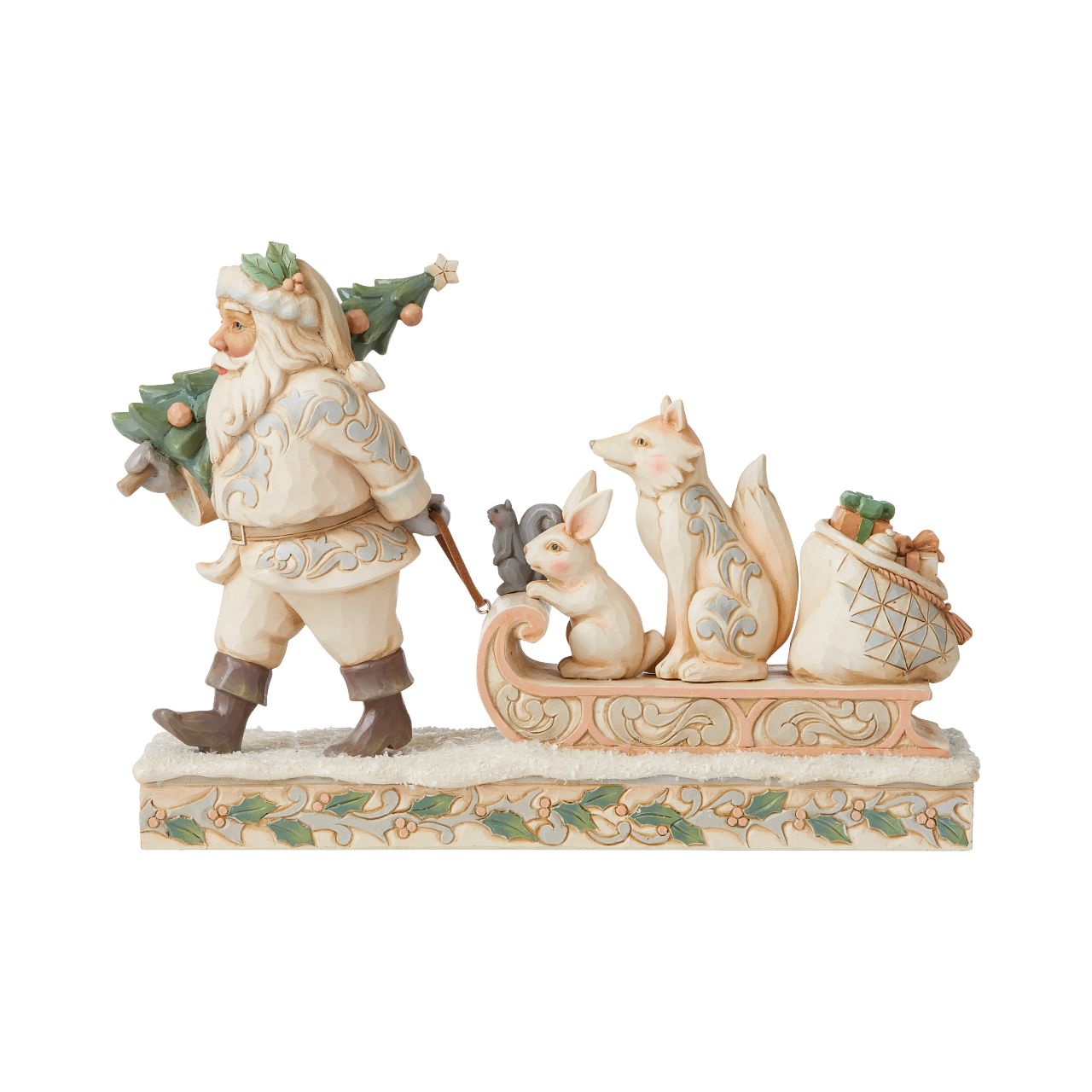 Jim Shore White Woodland Santa Pulling Sled Figurine  "A Wandering We Go" Santa is getting ready for Christmas with his furry friends. This piece features Santa dressed in the iconic, muted colours of White Woodland, whilst pulling a sled of forest animals and gifts.