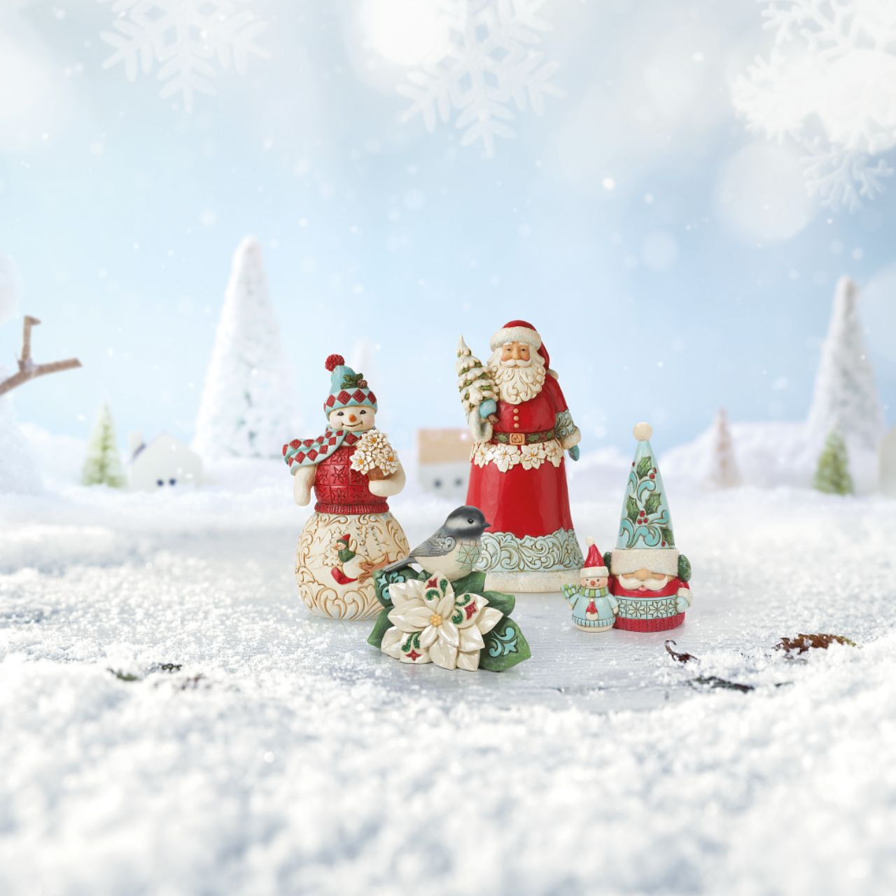 Winter Wonderland Collection Santa Figurine Holding Christmas Tree  Winter Wonderland Collection; Bright jewel tones, metallic shimmering and pearlized finishes and coloured glitter accents. This striking Santa holding a glittering Tree is the perfect addition to any Winter Wonderland Collection.