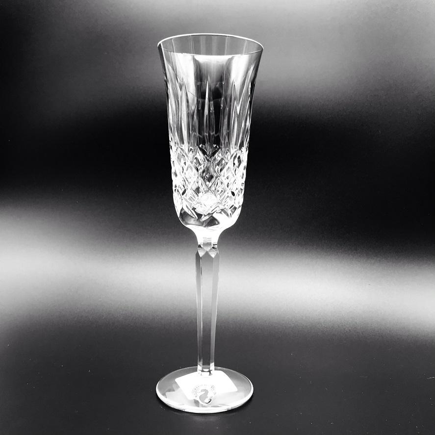Kelsey Flute Glass by Waterford Crystal  Kelsey Flute Champagne  Kelsey Collection by Waterford is characterized by a simple demi-lune shape accented by an open diamond pattern and adorned with single wedge cuts. 