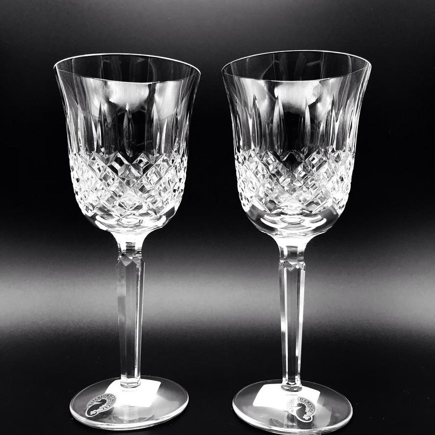 Kelsey Wine Pair by Waterford Crystal  Kelsey Collection by Waterford is characterized by a simple demi-lune shape accented by an open diamond pattern and adorned with single wedge cuts.