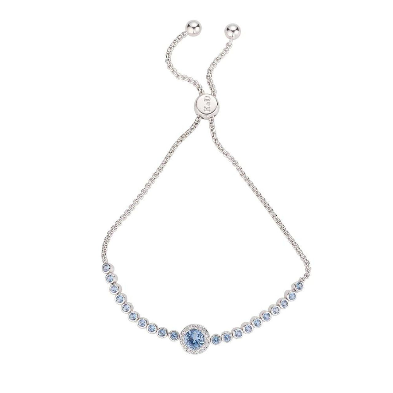 Blue Rhodium Bracelet by Knight & Day  Classic style bracelet embellished with light blue CZ stones. Slider fastening. Rhodium plating.