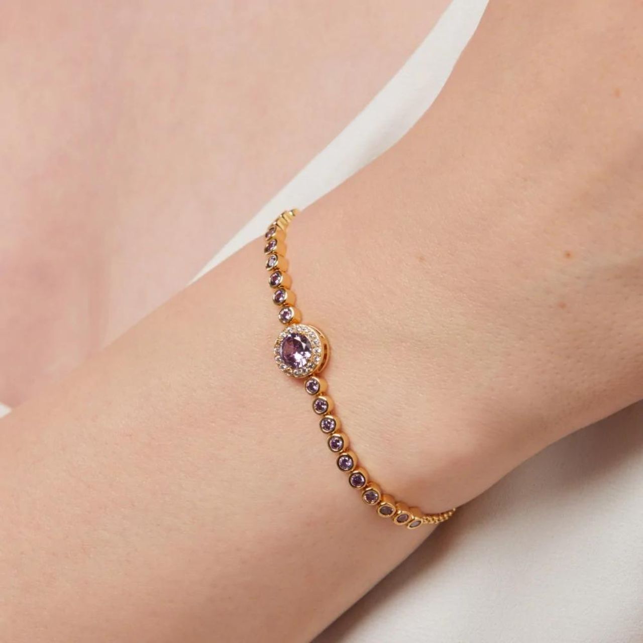 Knight & Day Classic Amethyst Bracelet  Classic style bracelet embellished with amethyst CZ stones. Slider fastening. Gold plating.