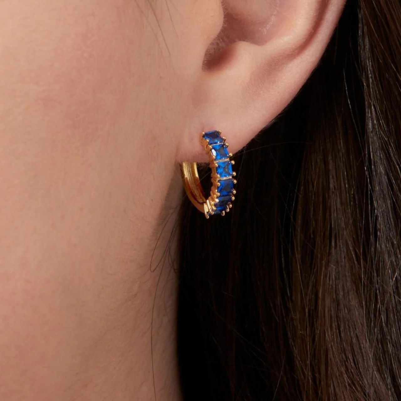 Knight & Day Classic Sapphire Hoops Earrings   Classic style hoops embellished with sapphire CZ stones. Gold plating.