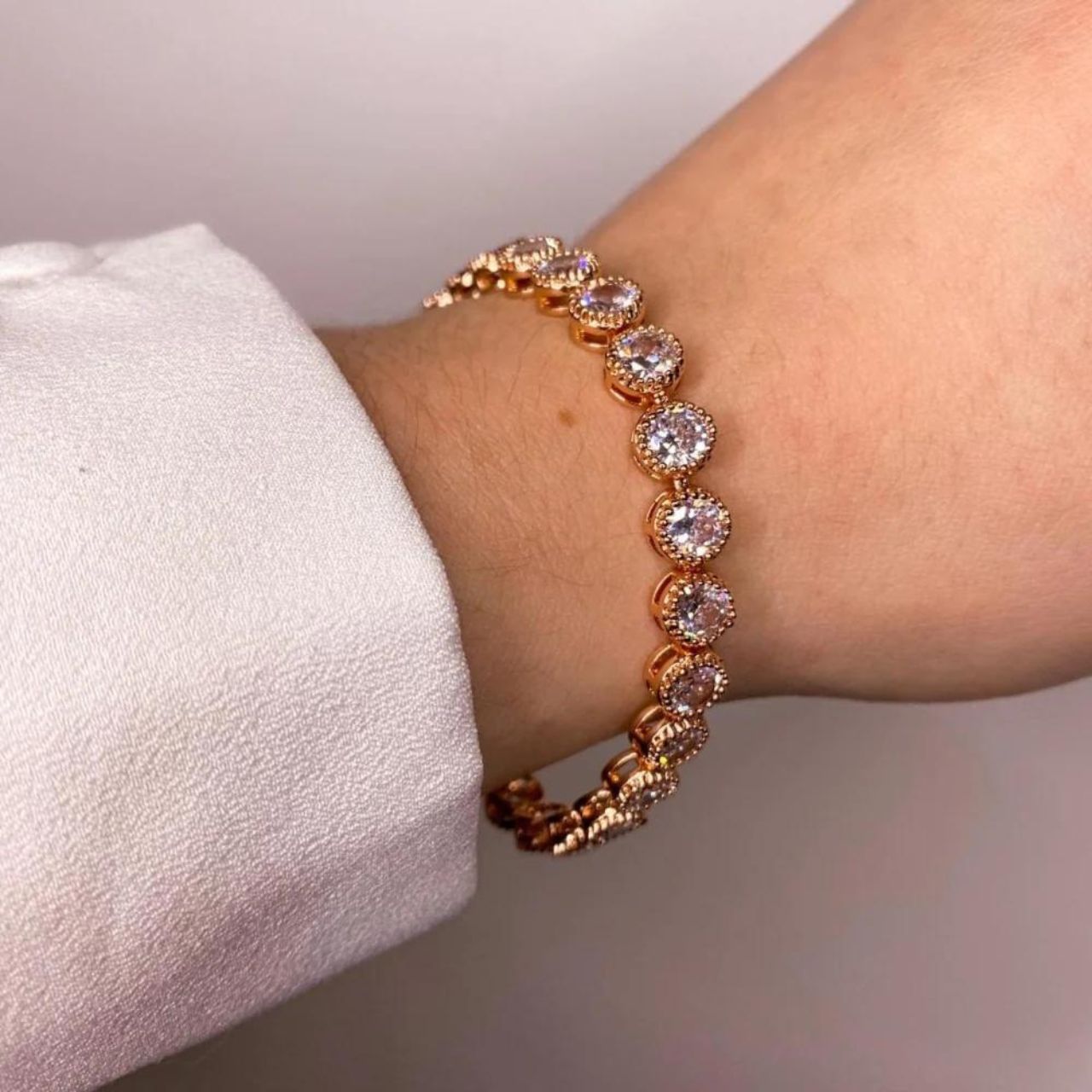 Knight & Day Danna Rose Gold Plated Tennis Bracelet  Beautiful rose gold plated tennis bracelet with CZ stones. Fold over clasp fastening.