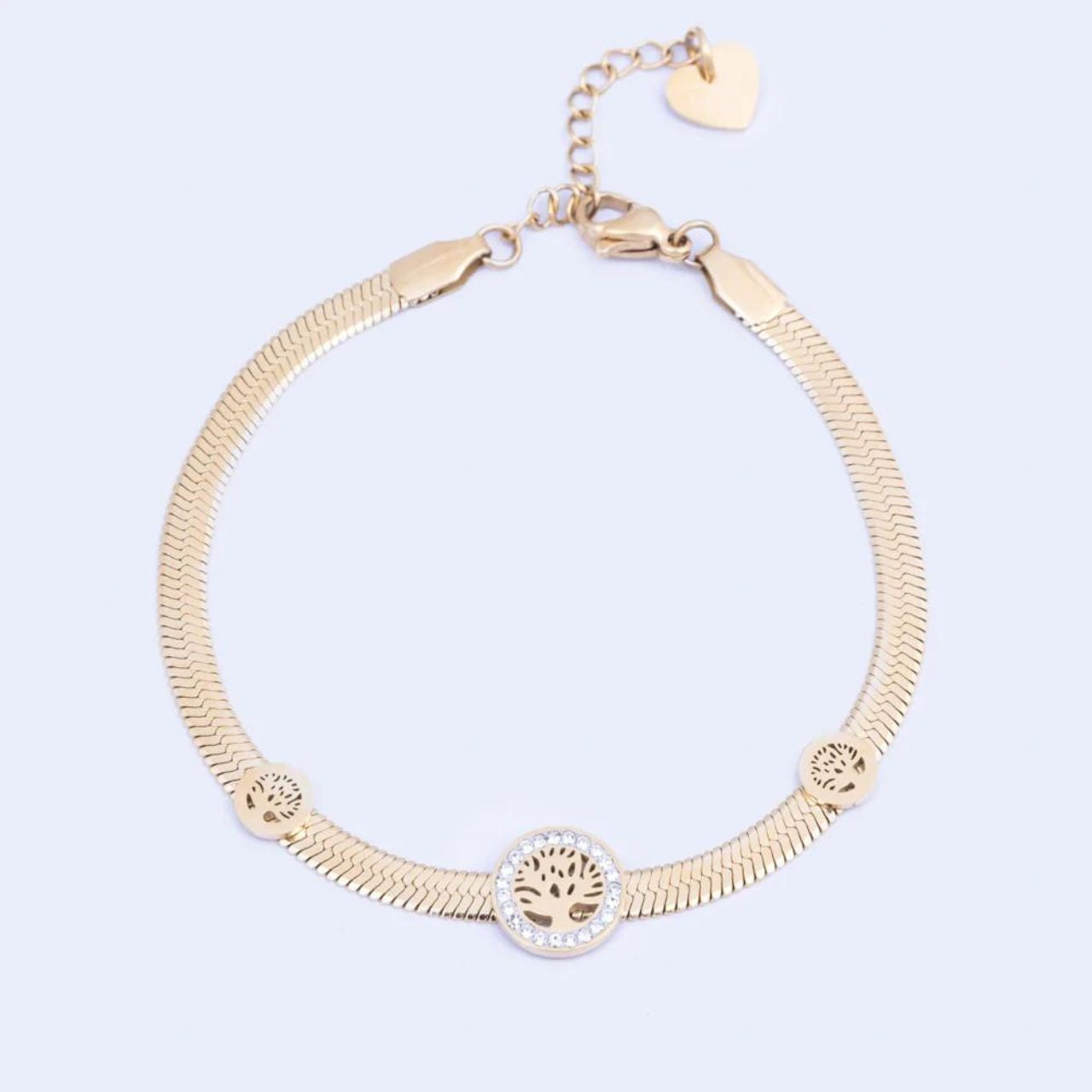 Knight & Day Yellow Gold Tree of Life Bracelet Flat snake chain bracelet embellished with Tree of Life Charms. Lobster claw fastening.  14k gold plating.