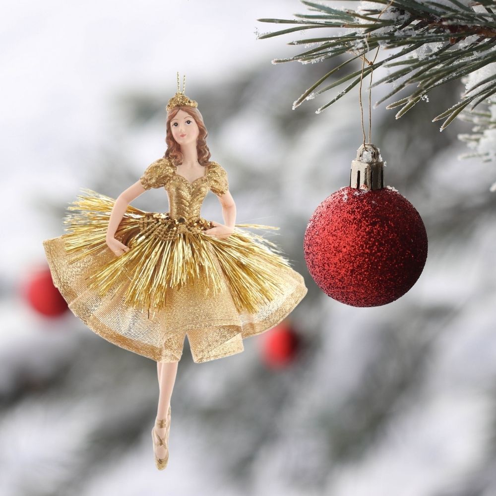 Kurt S Adler Gold Ballerina Christmas Ornament - Low Arm  Kurt Adler's gold ballerina ornaments are a beautiful addition to your home or holiday décor. Ballerinas wearing gold with tinsel accents, a gold glittered crown and gold ballet shoes.