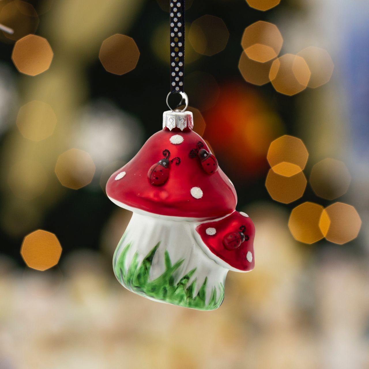 Ladybug On Mushroom Christmas Ornaments - Double Mushroom Head  Kurt Adler's red and white mushroom ornaments are a fun and festive addition to any holiday décor or Christmas tree. Double Mushroom head is decorated with green grass and red and black ladybugs.