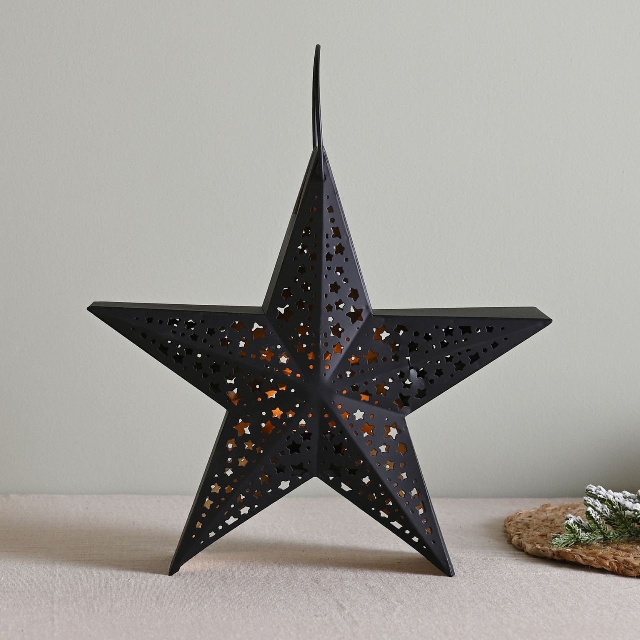 Black Star Christmas Lantern Medium  A medium black star lantern.  This enchanting lantern glistens with festive charm throughout the Christmas period.
