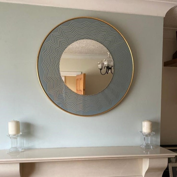 Mindy Brownes Liana Mirror  A powder blue mirror! Well that's trendy and fun to add to your home! Miami vibes, stylish round mirror with blue and gold geometric details. Stunning in a bathroom, children's bedroom or hallway for a pop of colour!