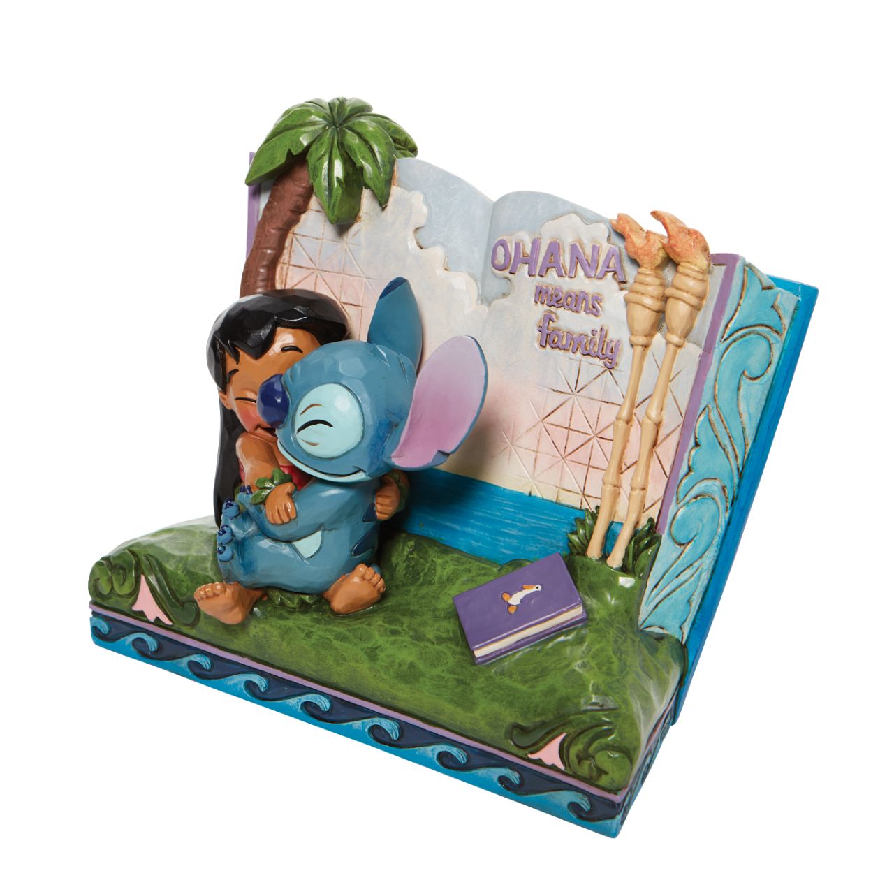 Disney Showcase Lilo and Stitch Storybook Figurine  Twenty years ago, Lilo & Stitch awarded audiences with an out of this world tale of friendship that hit us all close to home. In this piece, Lilo and Stitch hug within a storybook, allowing us all to learn a lesson of what family really means.