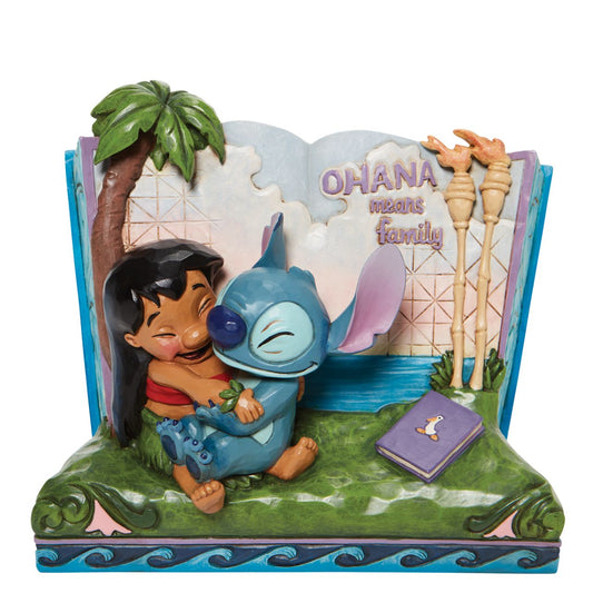 Disney Showcase Lilo and Stitch Storybook Figurine  Twenty years ago, Lilo & Stitch awarded audiences with an out of this world tale of friendship that hit us all close to home. In this piece, Lilo and Stitch hug within a storybook, allowing us all to learn a lesson of what family really means.