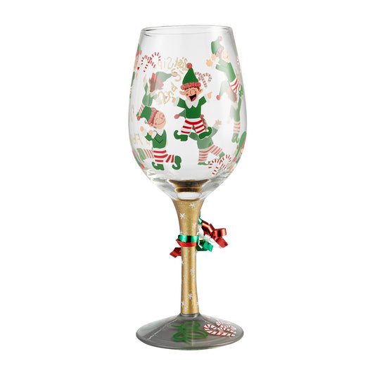 Tipsy Elf Wine Glass  Gleeful and gulping, the little elves decking this glass are sure to delight and intoxicate your holiday. Arrives in a beautiful gift box with signature recipe. Artisan blown glass. Hand wash only.