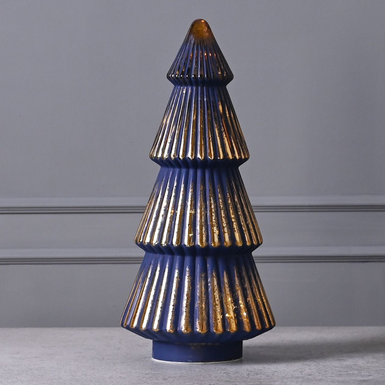 Medium Navy Crackle Glass LED Christmas Tree  A medium navy crackle effect LED Christmas tree.  This vibrant light up ornament makes a delightful addition to homes during the festive period.