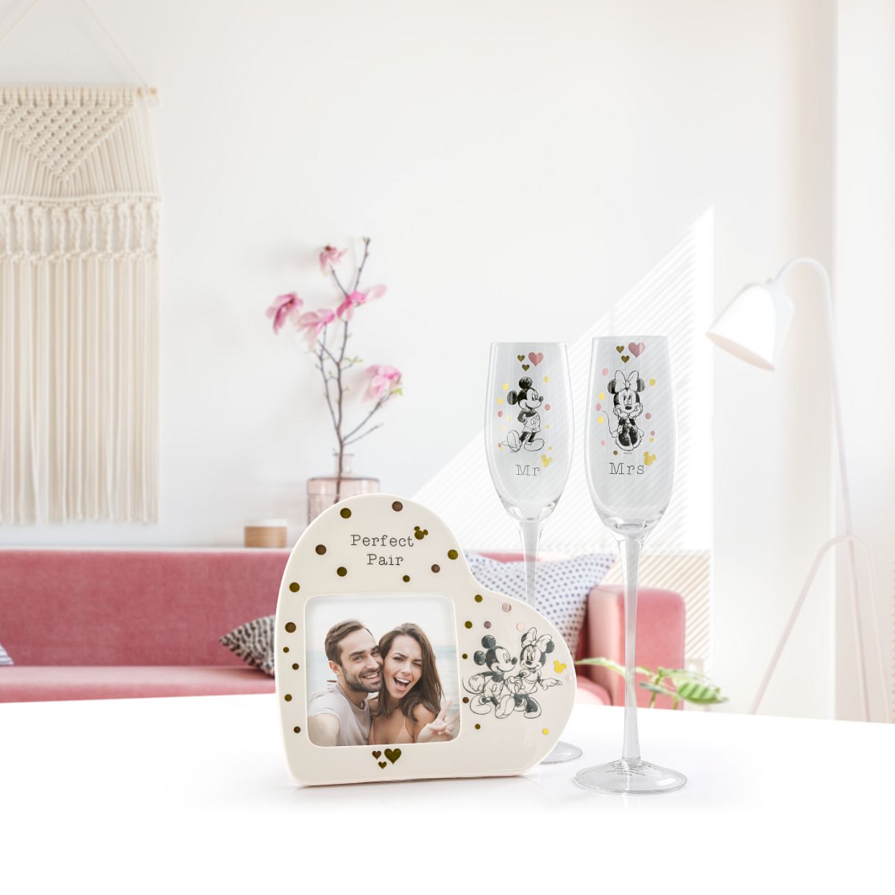 Mickey and Minnie Mouse Photo Frame  Mickey and Minnie are featured in this magical photo frame which holds a 4 x 4 inch photo, to show off your greatest love story. Packed in a Disney branded window gift box.