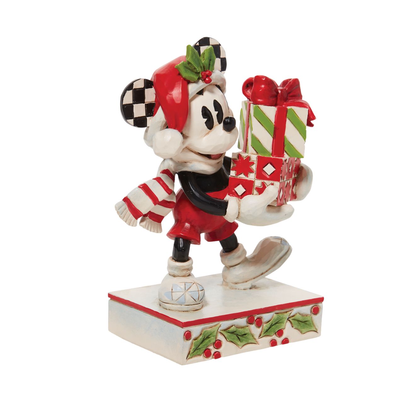 Jim Shore Christmas Mickey with Stack of Presents Figurine  Disney comes home for the holidays with this festive figurine by Jim Shore. Donning a candy cane striped scarf, Mickey wears a neighborly smile as he carries a towering stack of presents. The cheerful mouse boasts a holly brimmed Santa hat.