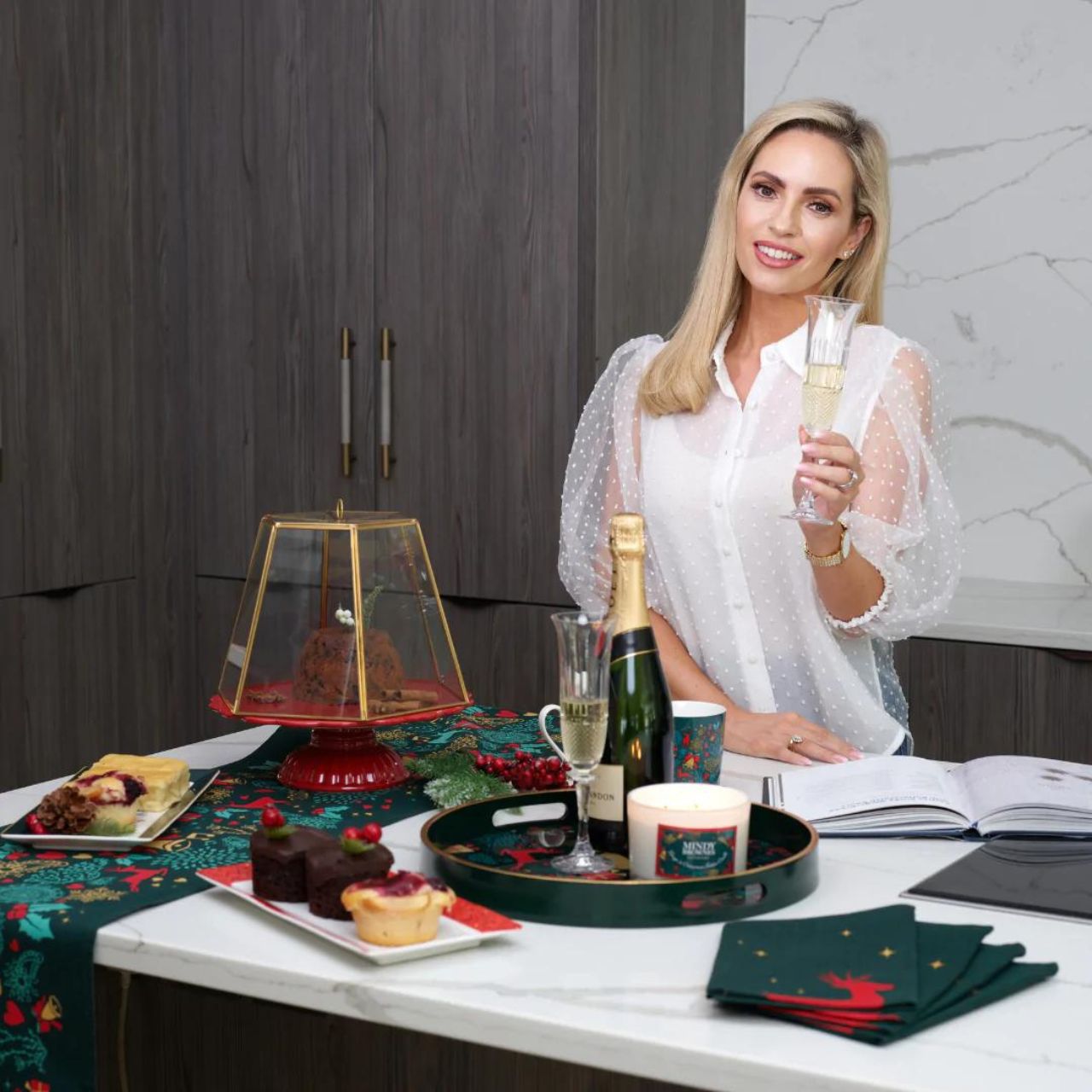 A Christmas Wish Tray by Mindy Brownes Interiors  A stunning circular tray, with a rich green surround, gold rim, and a Christmas design that features some of Christmas' key elements, such as reindeer, presents, music notes and more. An ideal styling accessory this Christmas season.
