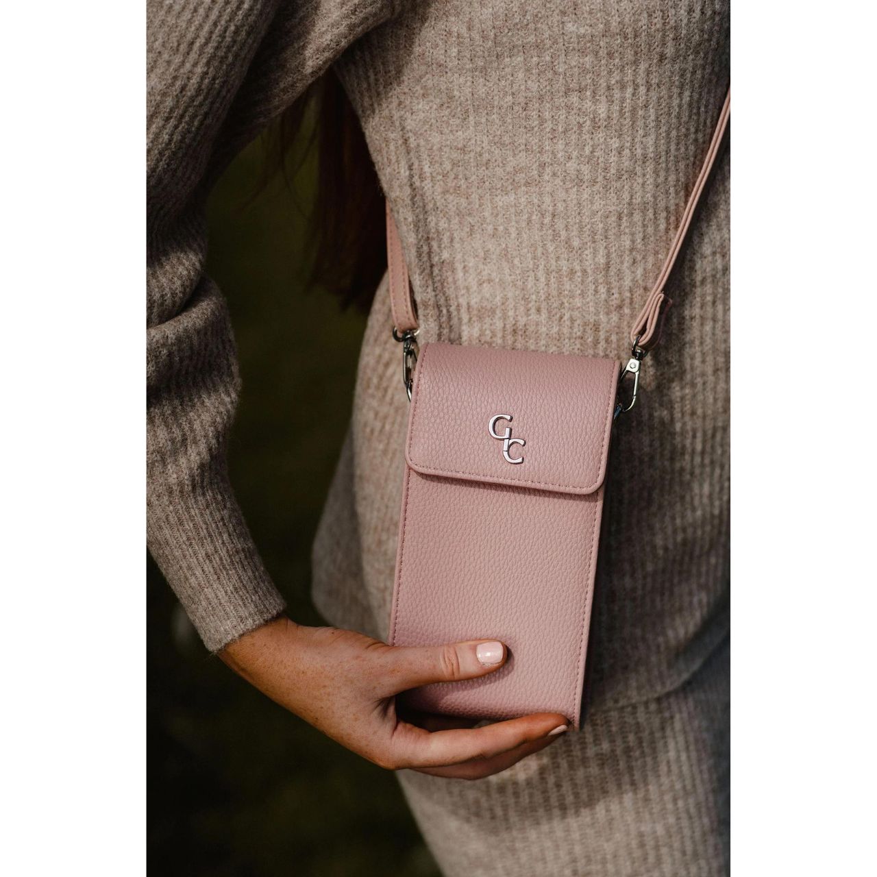 Galway Crystal Mini Cross Body Bag - Rose Pink  Introducing the new must have accessory that is truly functional. Our Light weight, Slim, Sleek, Crossbody bag is designed to hold the most essential accessory: Your mobile phone. There is nothing more liberating than carrying a lightweight bag that carries your essentials.