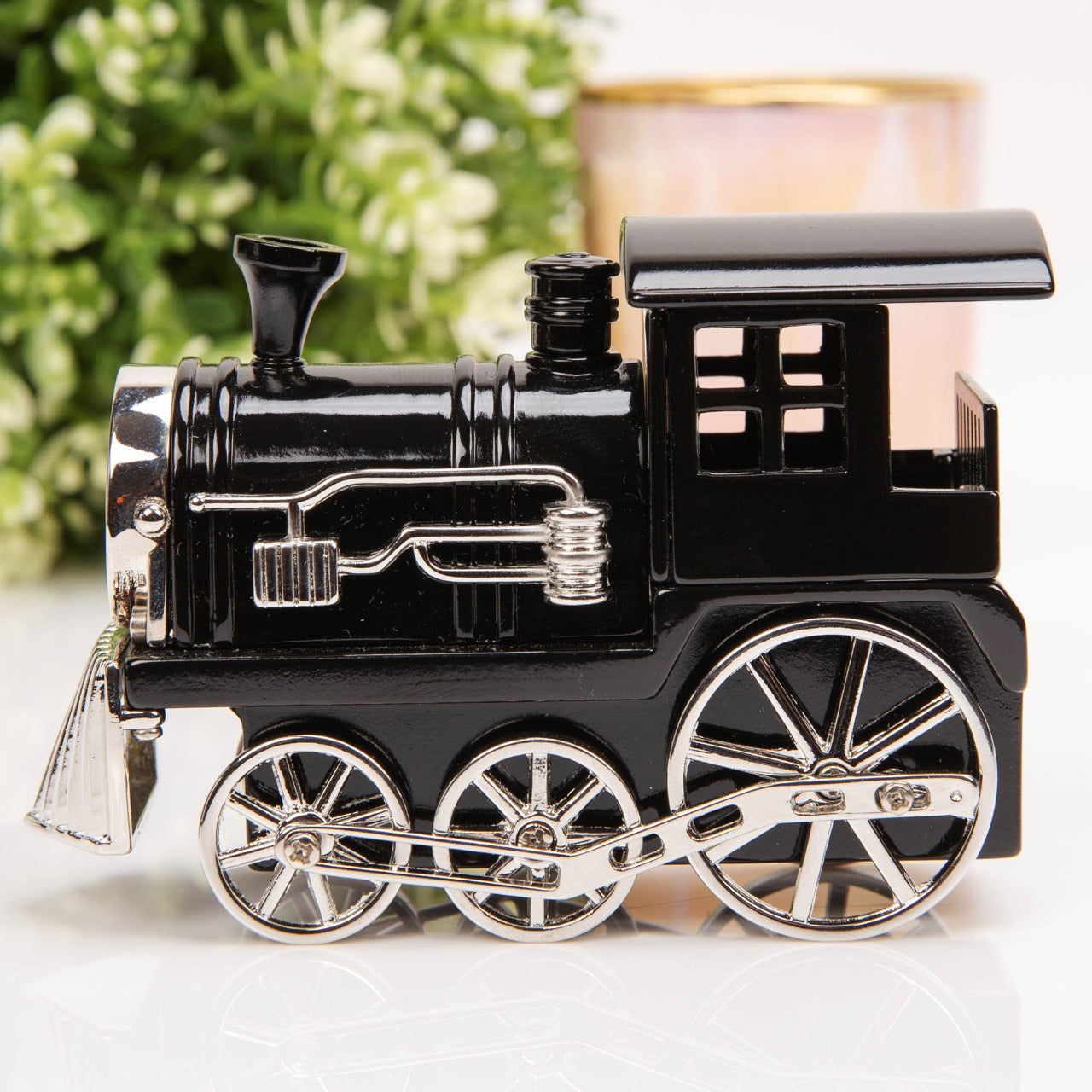 Miniature Clock - Black Steam Train  Give the train fanatic in your life the perfect gift with this intricately detailed miniature steam train clock. From WILLIAM WIDDOP - over 130 years of unrivalled innovation and unbeatable quality in British timekeeping.