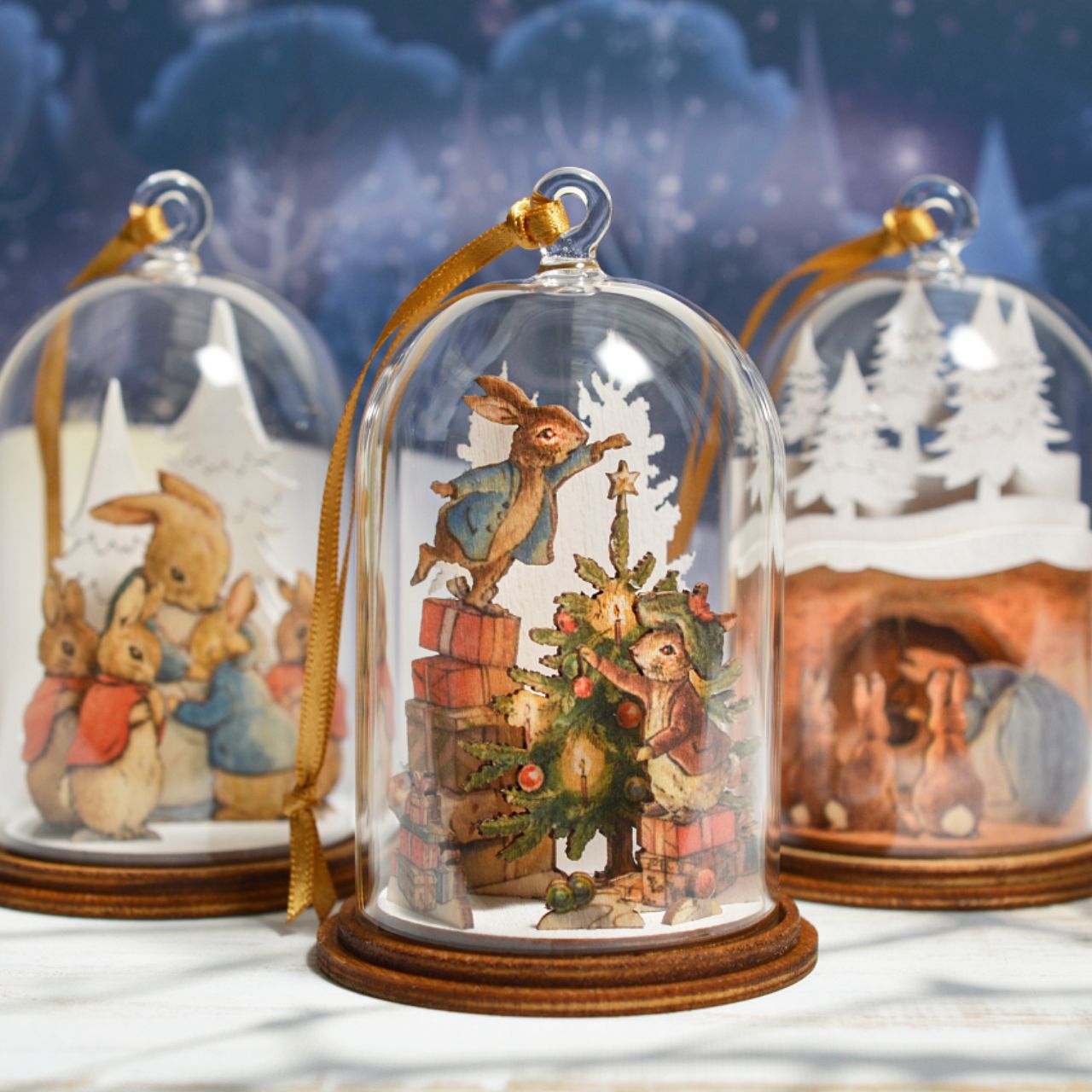 Mrs. Rabbit in Burrow Wooden Hanging Ornament  This charming Mrs. Rabbit wooden hanging ornament has been intricately created and comes encased in a beautiful eco-friendly glass dome. This classic vintage style helps bring to life the original illustrations from the Beatrix Potter stories.