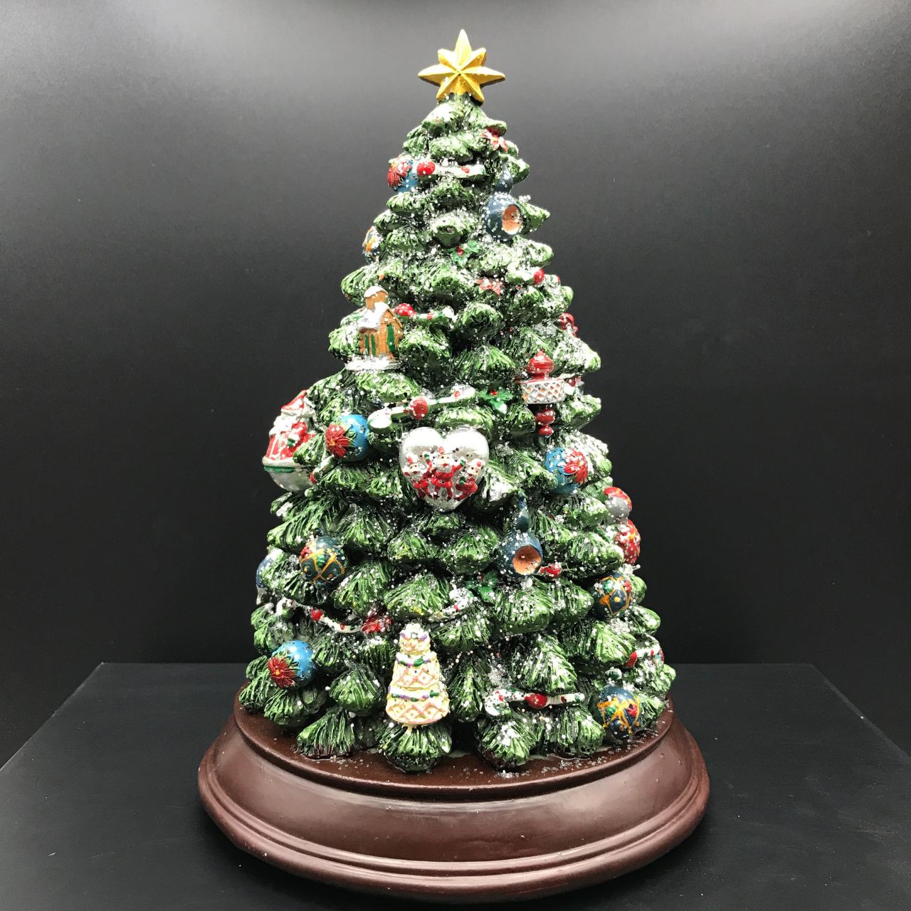 Music Box World Decorated Christmas Tree  - Medium  Christmas tree. The tree is illuminated (colour change) and plays 8 electronic Christmas carols. Battery operated