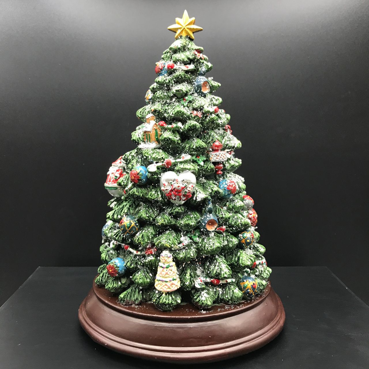 Music Box World Decorated Christmas Tree  - Medium  Christmas tree. The tree is illuminated (colour change) and plays 8 electronic Christmas carols. Battery operated