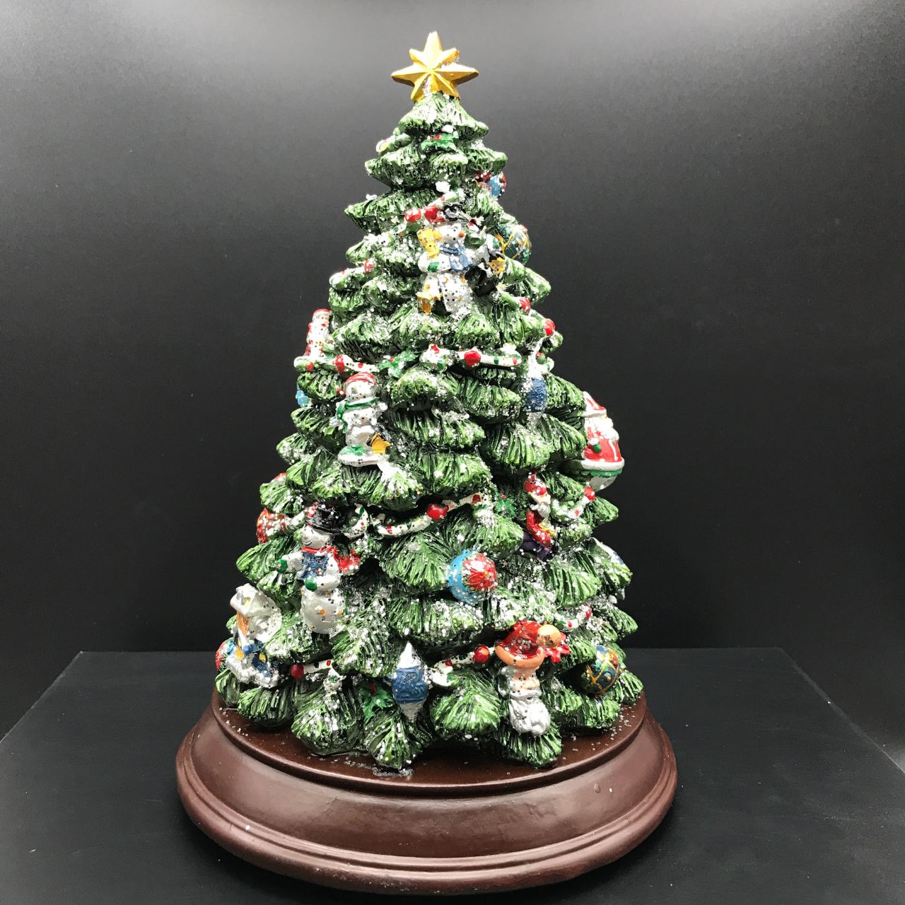 Music Box World Decorated Christmas Tree  - Medium  Christmas tree. The tree is illuminated (colour change) and plays 8 electronic Christmas carols. Battery operated