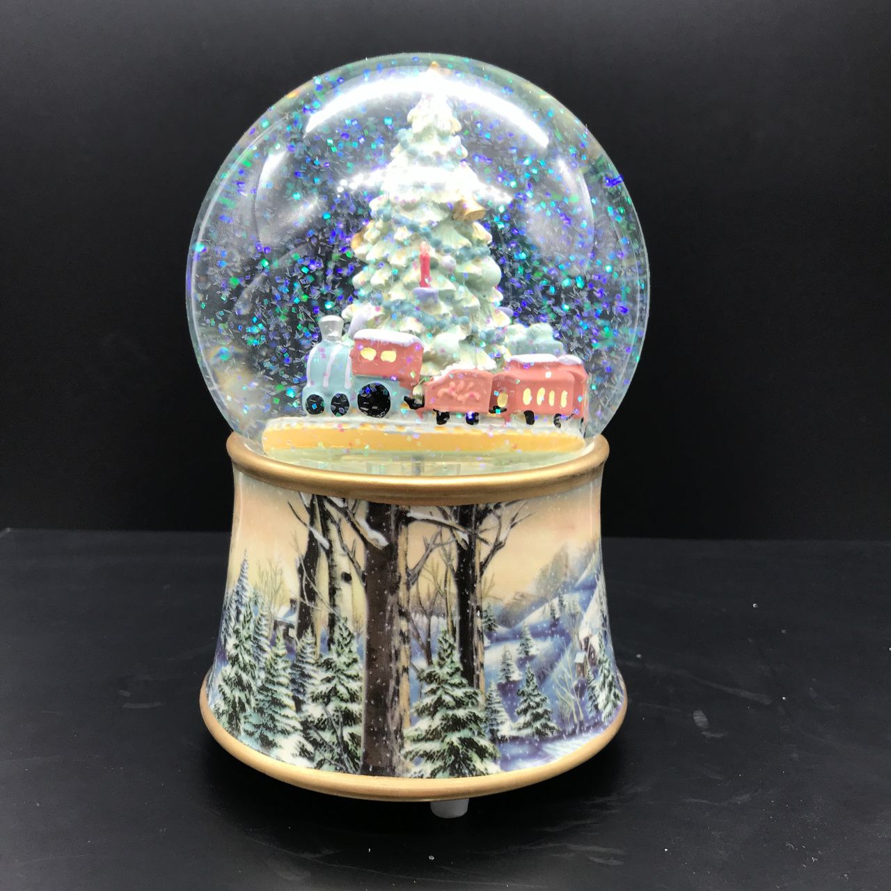 Music Box World Snow Globe Christmas Tree with Train  Featuring festive scenes and characters, add charm and personality to your home this Christmas with our fabulous snow globes