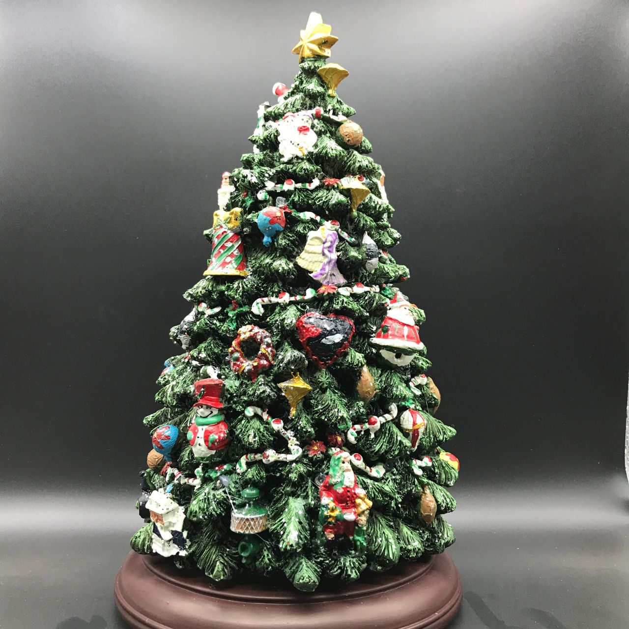 Music Box World Christmas Tree with LED's  Christmas tree with LED's. The very detailed Christmas tree stands on a dark brown base. When the switch is turned on, the tree is lit with colourful LED's and rotates on the base while 8 different melodies play. 