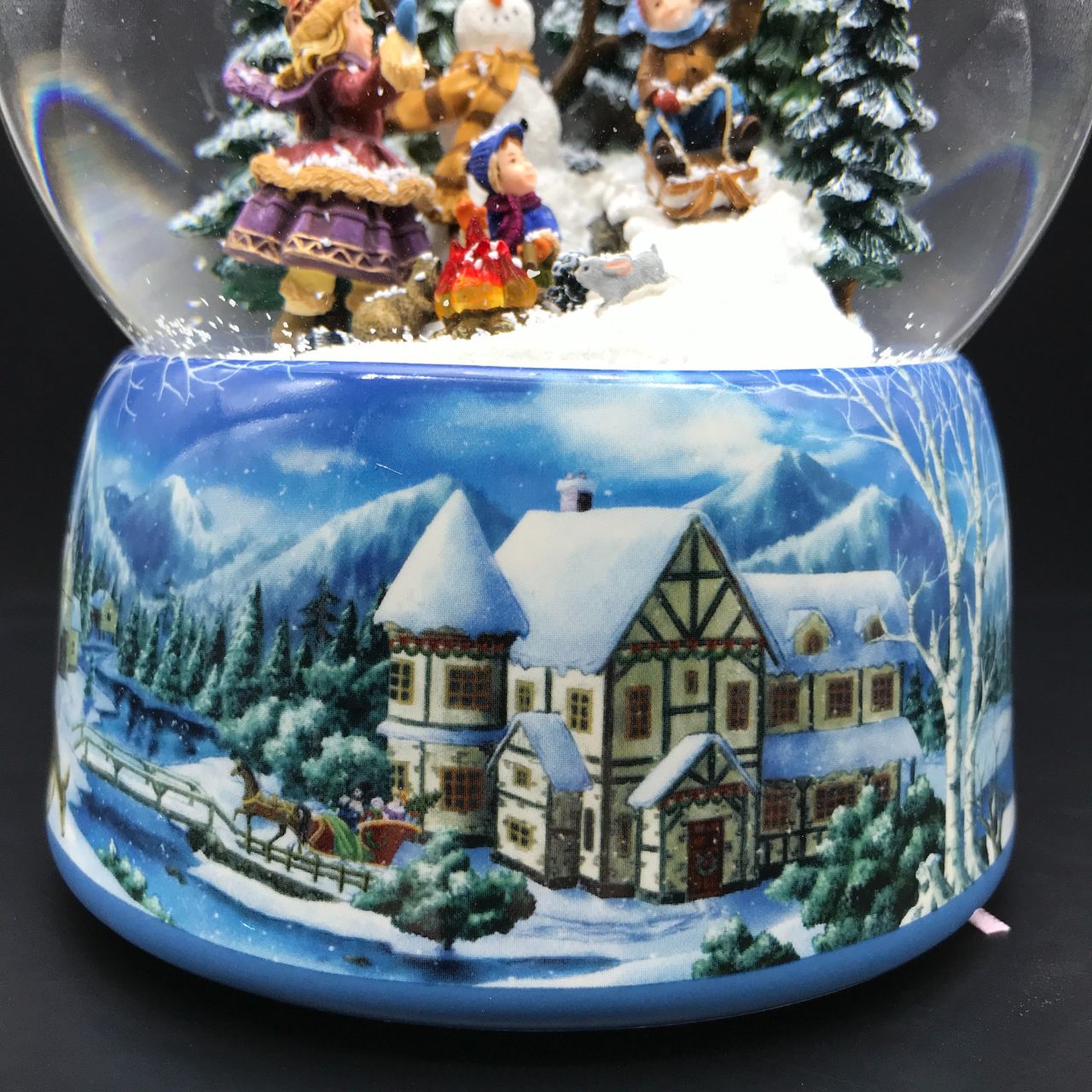 Music Box World Snow Globe Snowman - Large  Snowman snow globe plays the melody “Leise Rieselt der Schnee”. The snow swirls automatically and the camp fire lights up.  Melody: Leise Rieselt der Schnee