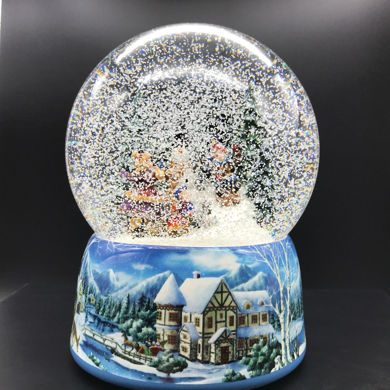 Music Box World Snow Globe Snowman - Large  Snowman snow globe plays the melody “Leise Rieselt der Schnee”. The snow swirls automatically and the camp fire lights up.  Melody: Leise Rieselt der Schnee