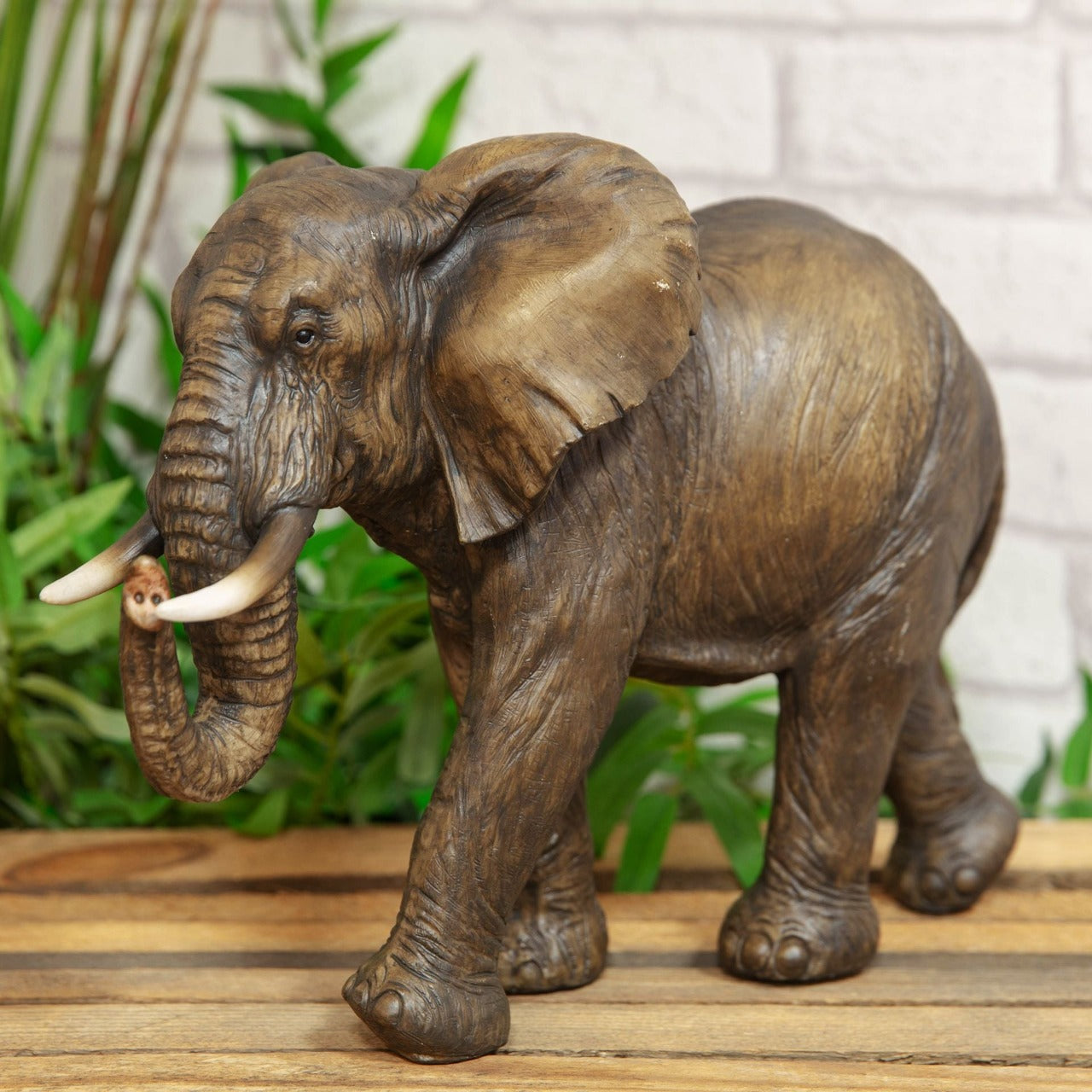 Elephant Figurine 23cm - Naturecraft Collection  An intricately hand painted resin elephant figurine. From Naturecraft - the one stop shop for wildlife enthusiasts.