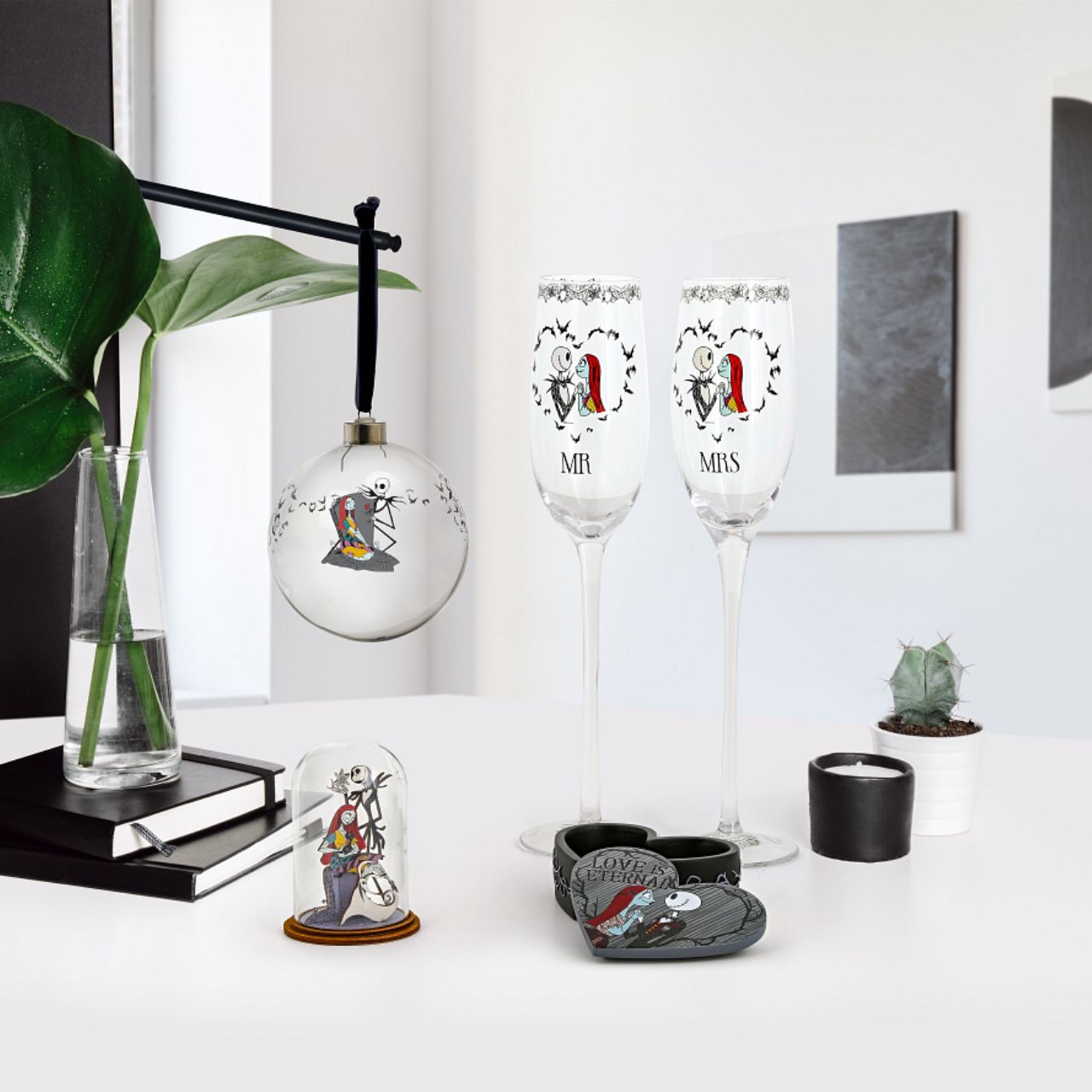 Disney Christmas Bauble Nightmare Before Christmas Bauble  This glass Nightmare Before Christmas bauble is the perfect gift to remind the happy couple that their eternal love is simply meant to be. The bauble is strung with black ribbon and is presented in a Disney branded gift box.