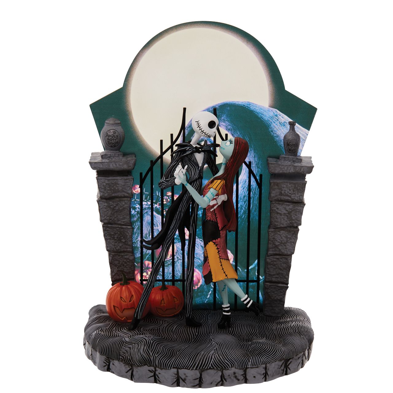 Nightmare Before Christmas Figurine  A lit up Halloween moon forms the back drop of this endearing scene from The Nightmare Before Christmas. Jack and Sally's graveyard waltz is frozen in time with only jack-o-lanterns as their witnesses. 