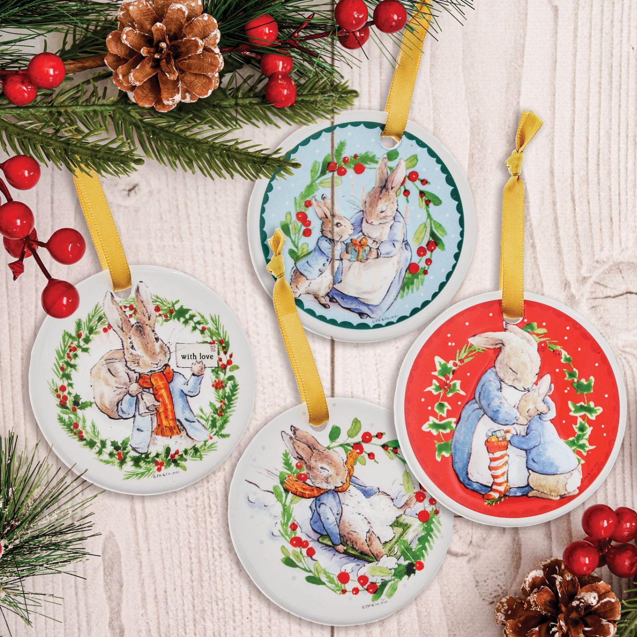 Beatrix Potter Peter Rabbit Ceramic Hanging Ornaments Set of 4  Peter Rabbit Hanging Ornaments with gold ribbon will add the spirit of Christmas to any household. With four different images, all from the original Beatrix Potter illustrations and stories, these Peter Rabbit Hanging Ornaments are extra special. Coming in a branded gift box, these make a great gift or self purchase.