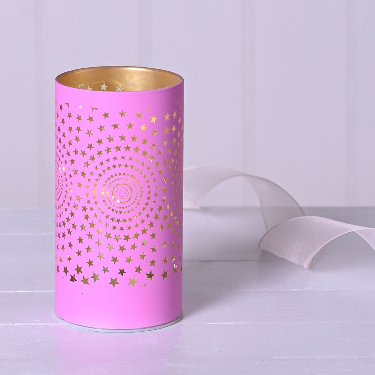 Christmas Pink Starburst LED Light Tube  A pink starburst LED tube light.  This illuminating light makes a delightful twist on the traditional this Christmas.