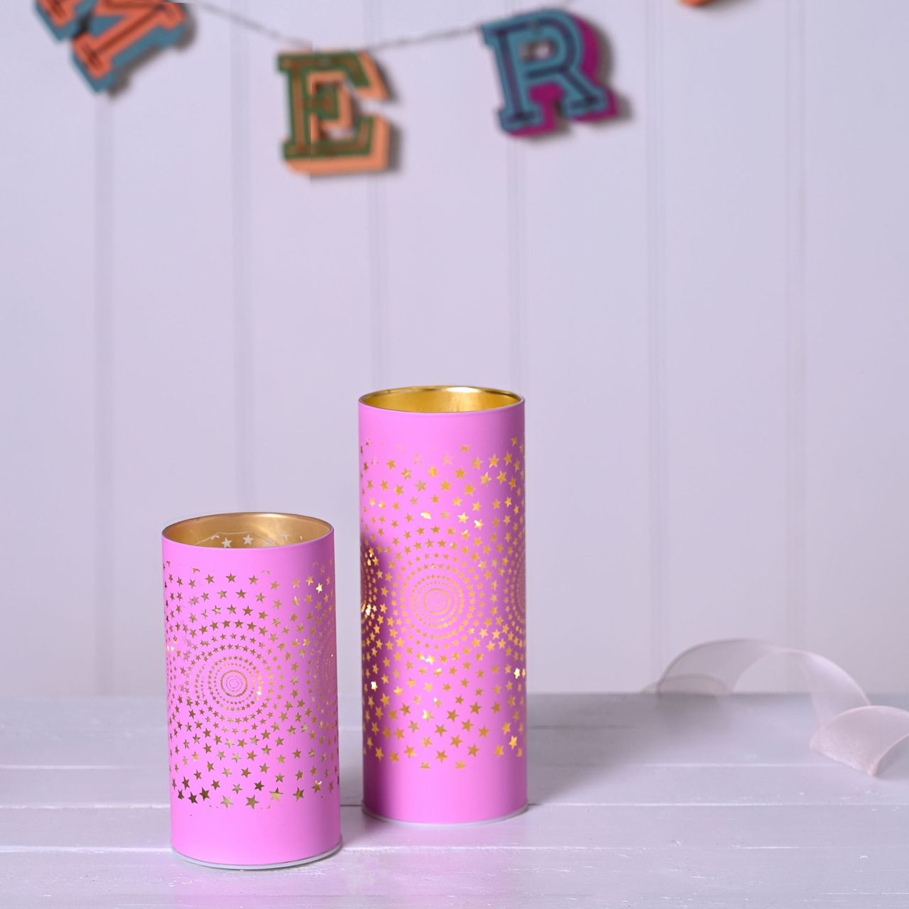 Christmas Pink Starburst LED Light Tube  A pink starburst LED tube light.  This illuminating light makes a delightful twist on the traditional this Christmas.
