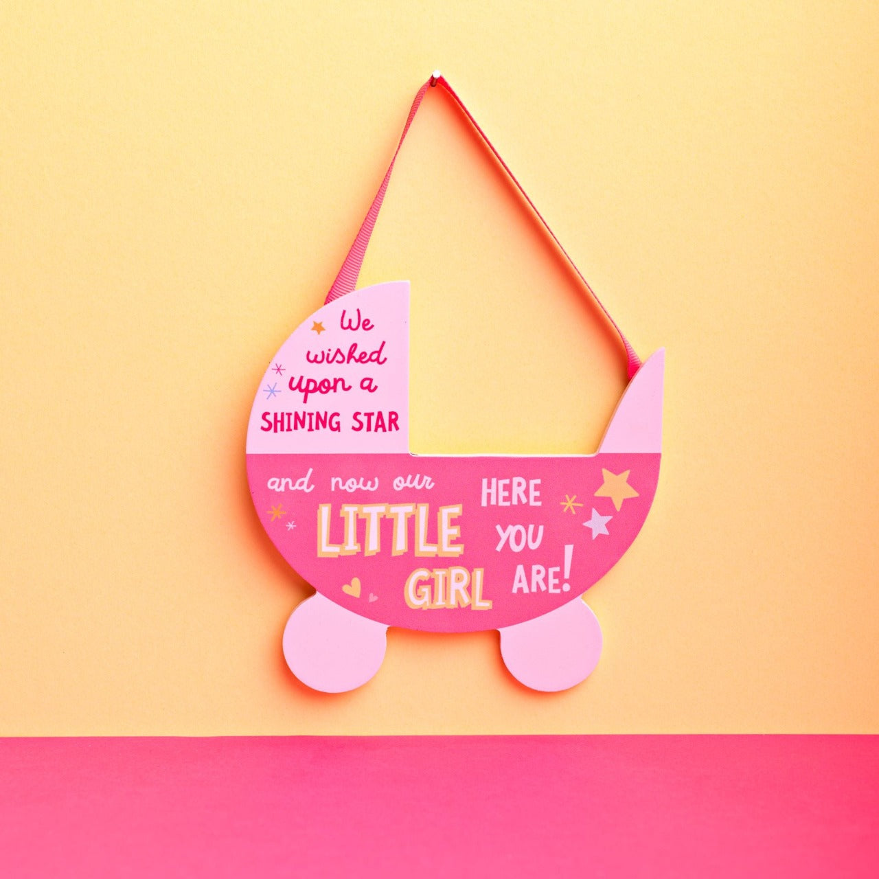 Pink Pram Hanging Plaque - Little Girl  Want to show someone you care? Then why not gift this ‘Little Girl’ bright, uplifting and cheerful pram plaque as a token of your love.