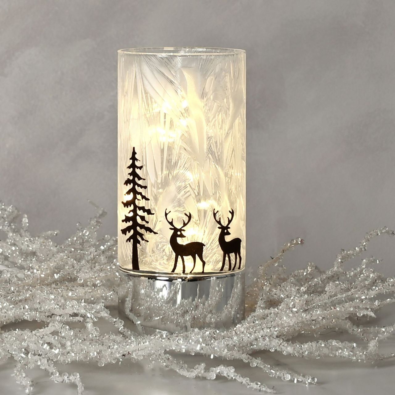 Medium Reindeer with Tree Christmas LED Light Tube  A medium reindeer with tree LED light tube.  This illuminating decoration is a delightful twist on the traditional this Christmas.