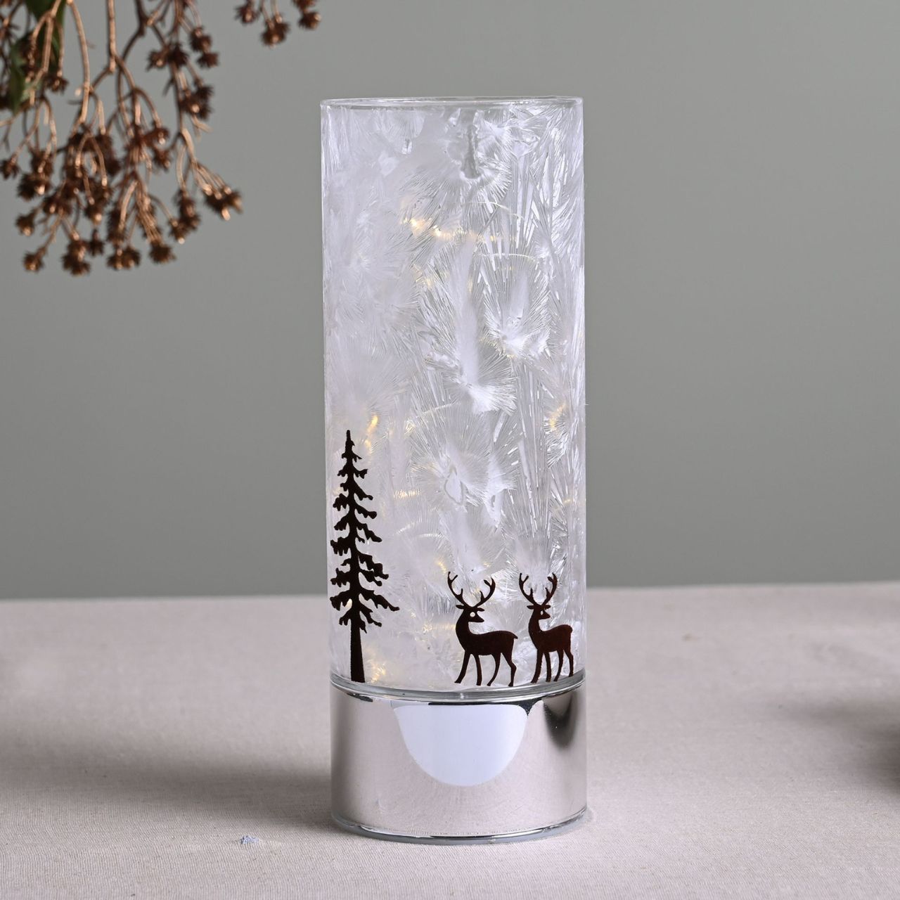 Large Reindeer with Tree Christmas LED Light Tube  A large reindeer with tree LED light tube.  This illuminating decoration is a delightful twist on the traditional this Christmas.