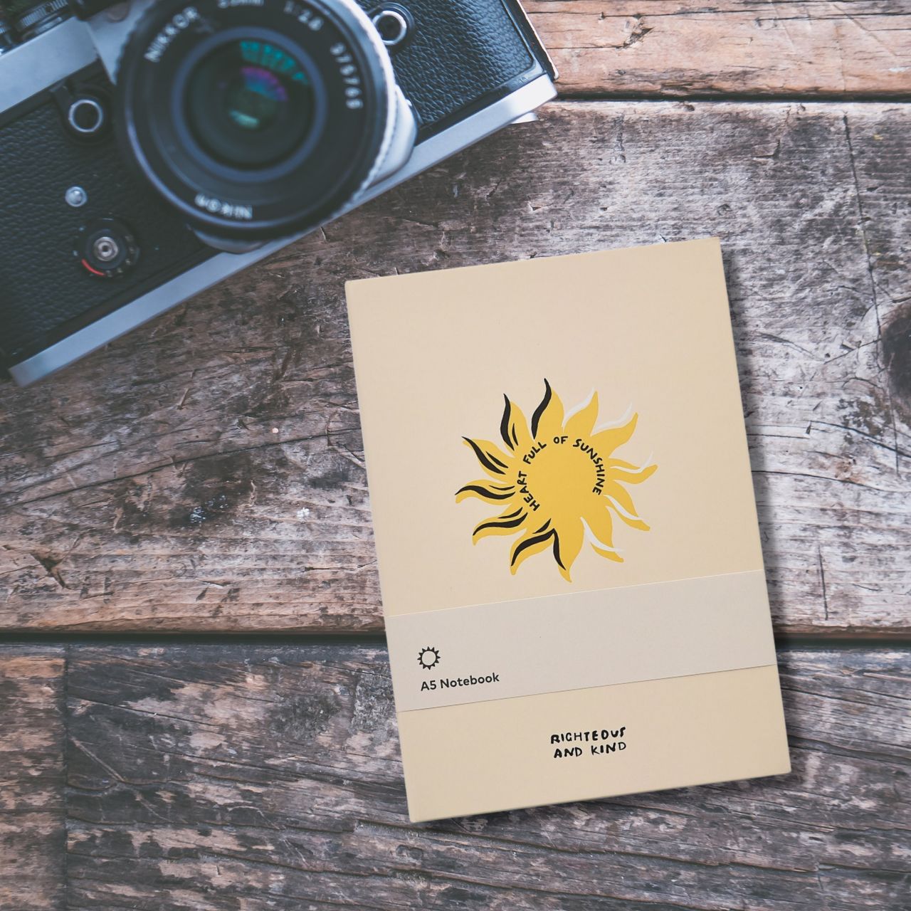 Righteous & Kind A5 Notebook  A stylish notebook that would make a beautiful gift for those who love to note down their thoughts or doodle. With a gold sun design, this would make a cute addition to any free spirit's stationary collection.