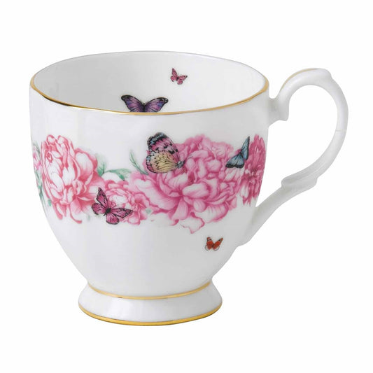Royal Albert Miranda Kerr Gratitude Mug  Delicate, delightful and totally Miranda, makes this item the perfect gift for the sophisticated and feminine woman, who enjoys to celebrate with friends or simply when she needs to take time for herself with a nice mug of tea or coffee. 'Gratitude' features a sophisticated scattering of peach and pink peony flowers; peppered with signature multi-coloured, purple and turquoise butterflies.