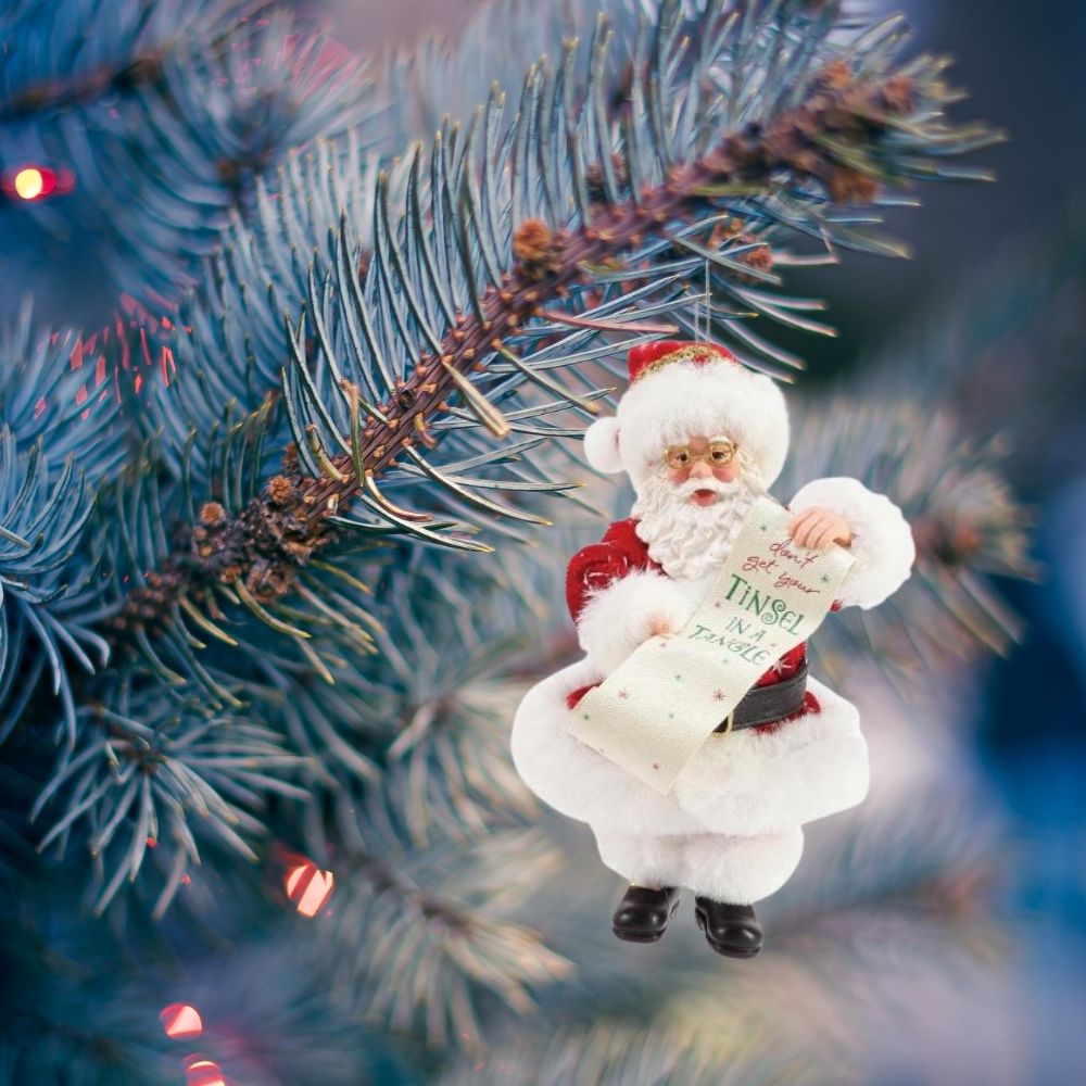 Santa Tinsel in a Tangle Hanging Christmas Ornament  This Clothtique hanging ornament captures Santa at his keenest. Bespectacled and bearing a long list labeled "Don't Get Your Tinsel in a Tangle"