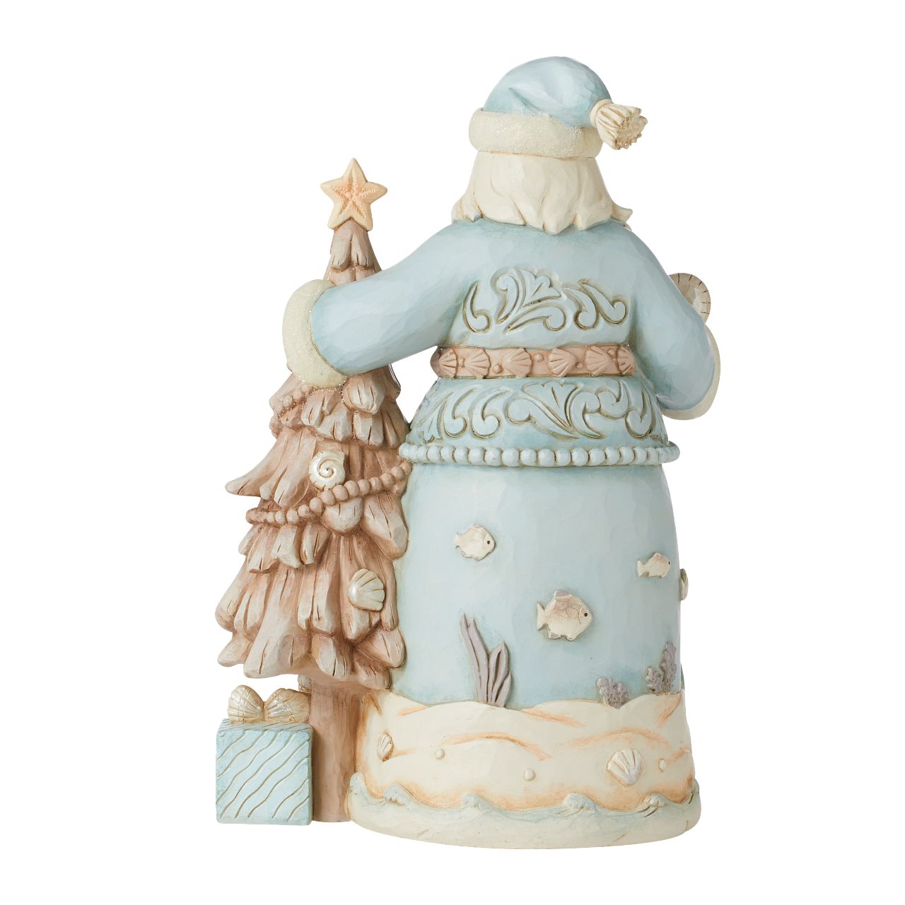Santa with Starfish Tree Figurine  The joy of Christmas festivities meets the relaxing calm of the sea in this Costal Collection for Heartwood Creek by Jim Shore. This stunning Santa in blue adorned with shells and coral is truly delightful.