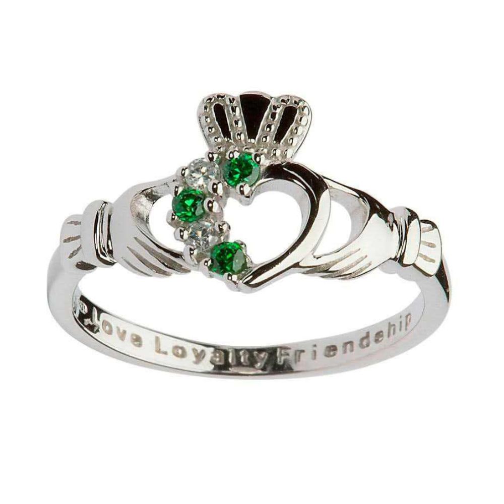 Beautifully etched with the words Love, Loyalty and friendship, this sterling silver ring is a stylish rendition of an Irish tradition. The ornate pattern includes a highly detailed set of hands, a delicate crown and a bejeweled heart. Four stones add an asymmetric, modern design to this traditional ring.