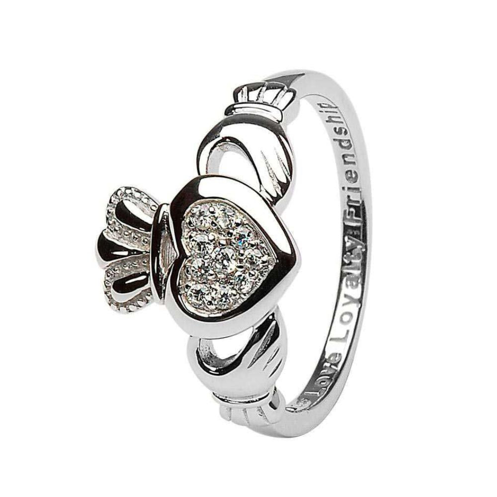 This exquisite ring is a fresh and mature take on the famous Celtic lover's band: the Claddagh Ring. Crafted delicately of Sterling silver, the ring is wonderfully detailed- from the cuffs around the hands to the patterns on the crown. But the true focus of the ring is rightly on the central heart. There ten brilliant CZ's are pave set in the heart itself to form a glorious focus for the ring.
