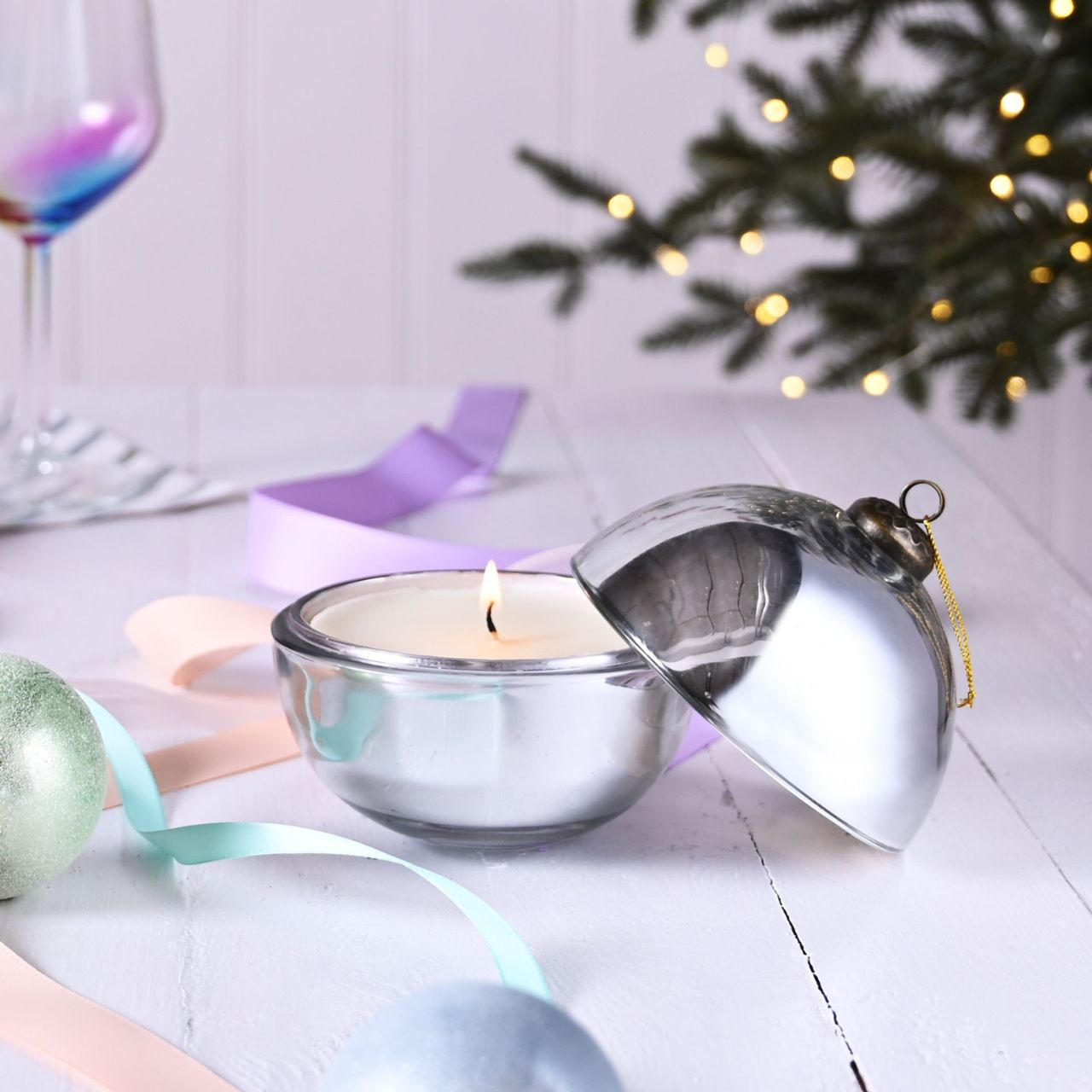 Silent Night Fragranced Glass Bauble Candle Christmas Silver  A Silent Night fragranced glass bauble candle.  This aromatic candle makes an eye-catching addition to homes during the festive season.