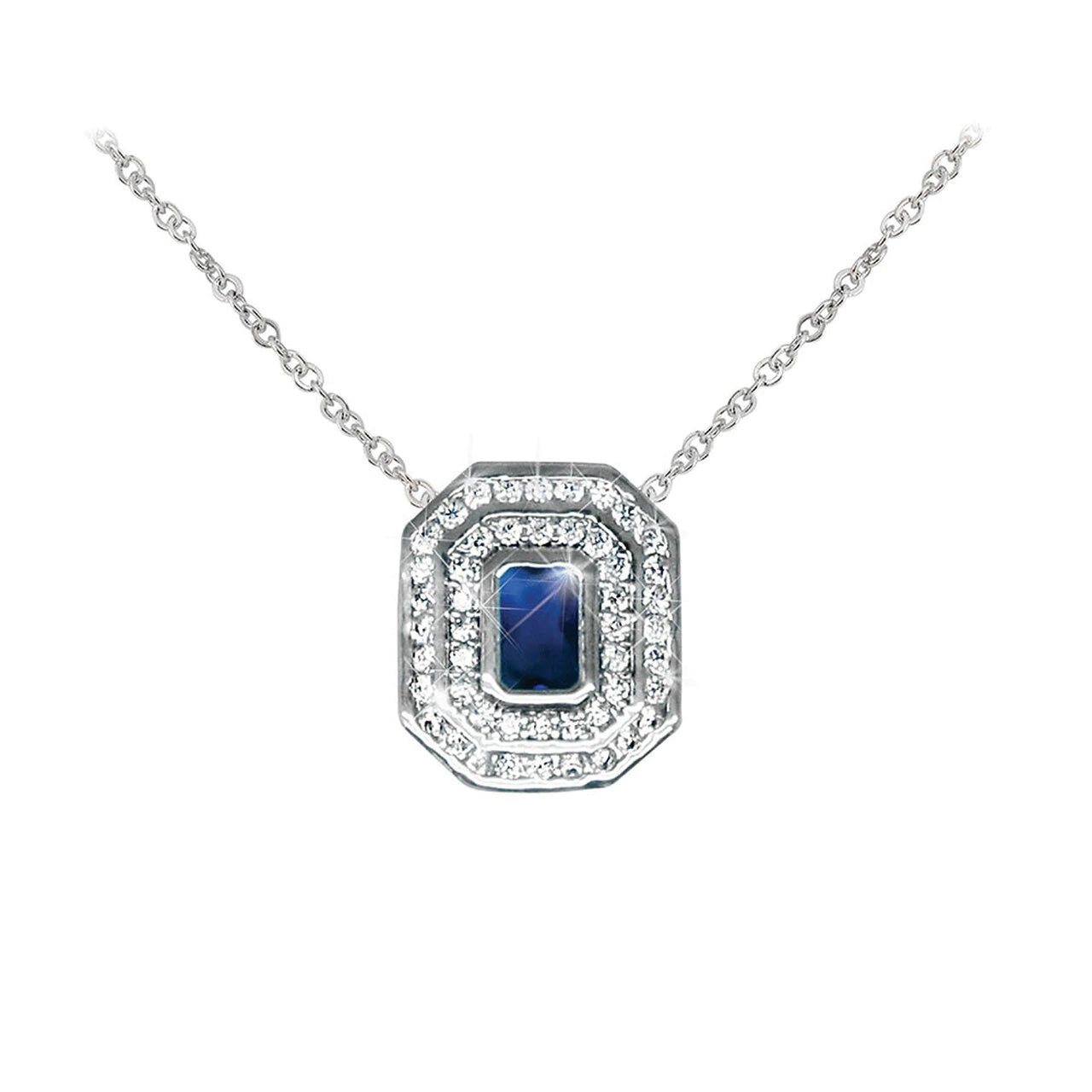 Tipperary Crystal Silver Pendant Sapphire & White Stone Surround  Elegance and pizzaz are presented in equal measure with this rich sapphire pendant. The dazzling double halo of bright round clear crystals intensiﬁes the radiance of the blue emerald-cut center stone.