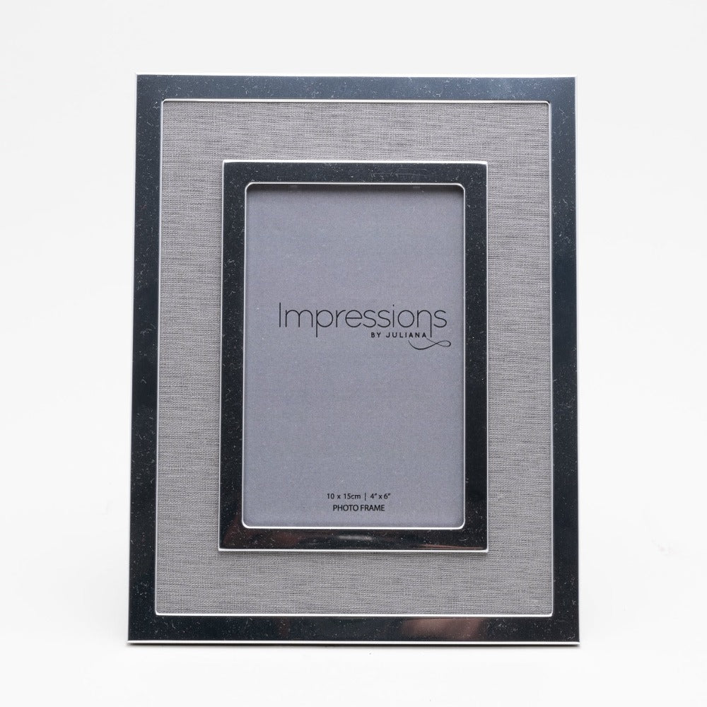 Silver Plated Photo Frame with Grey Linen Insert 4" x 6"  Give a precious photo the perfect place to shine with this stylish silver-plated photo frame with a grey linen insert. From Impressions - helping your precious pictures speak their thousand words.